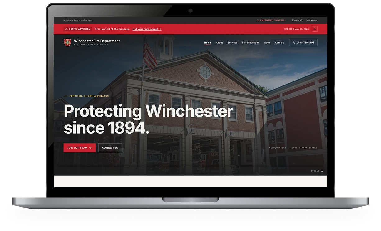 Custom fire department website shown on a laptop